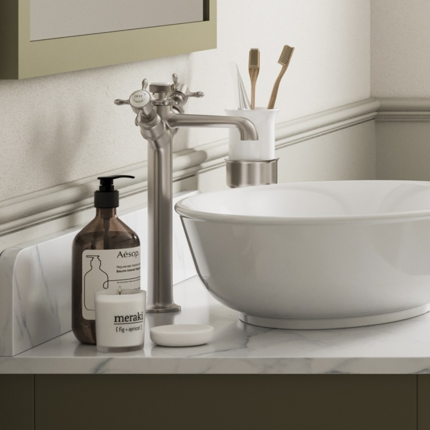 Product lifestyle image of Burlington Guild Brushed Nickel Tall Mono Basin Tap side angle behind countertop basin with hand soap bottle GU112DNL